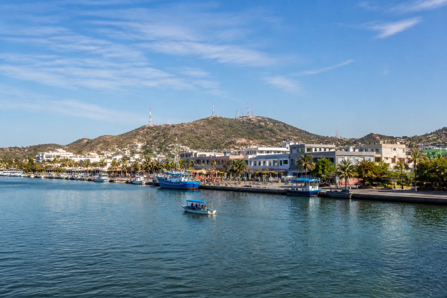 Representative cruise port destination view: Topolobampo, Mexico; passenger waterfront and harbor water, not an exact landmark photograph.