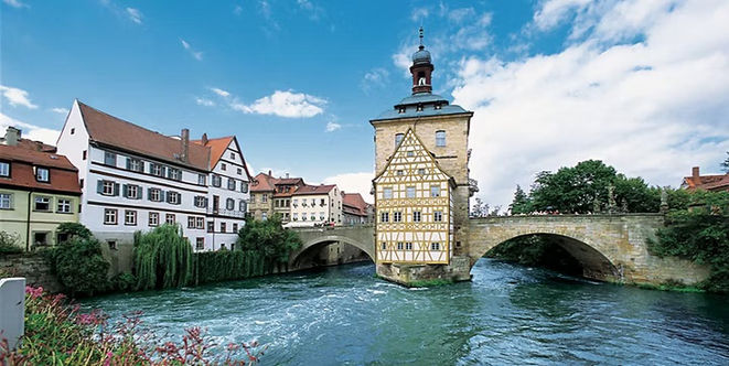 Historic church towers and surrounding architecture in Bamberg, Germany.