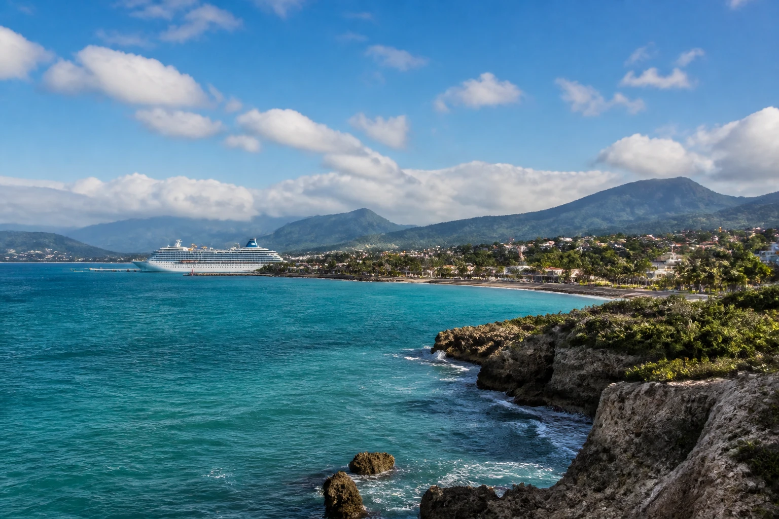 Representative coastal destination view: Puerto Plata, Dominican Republic; coastline and regional vegetation, not an exact landmark photograph.