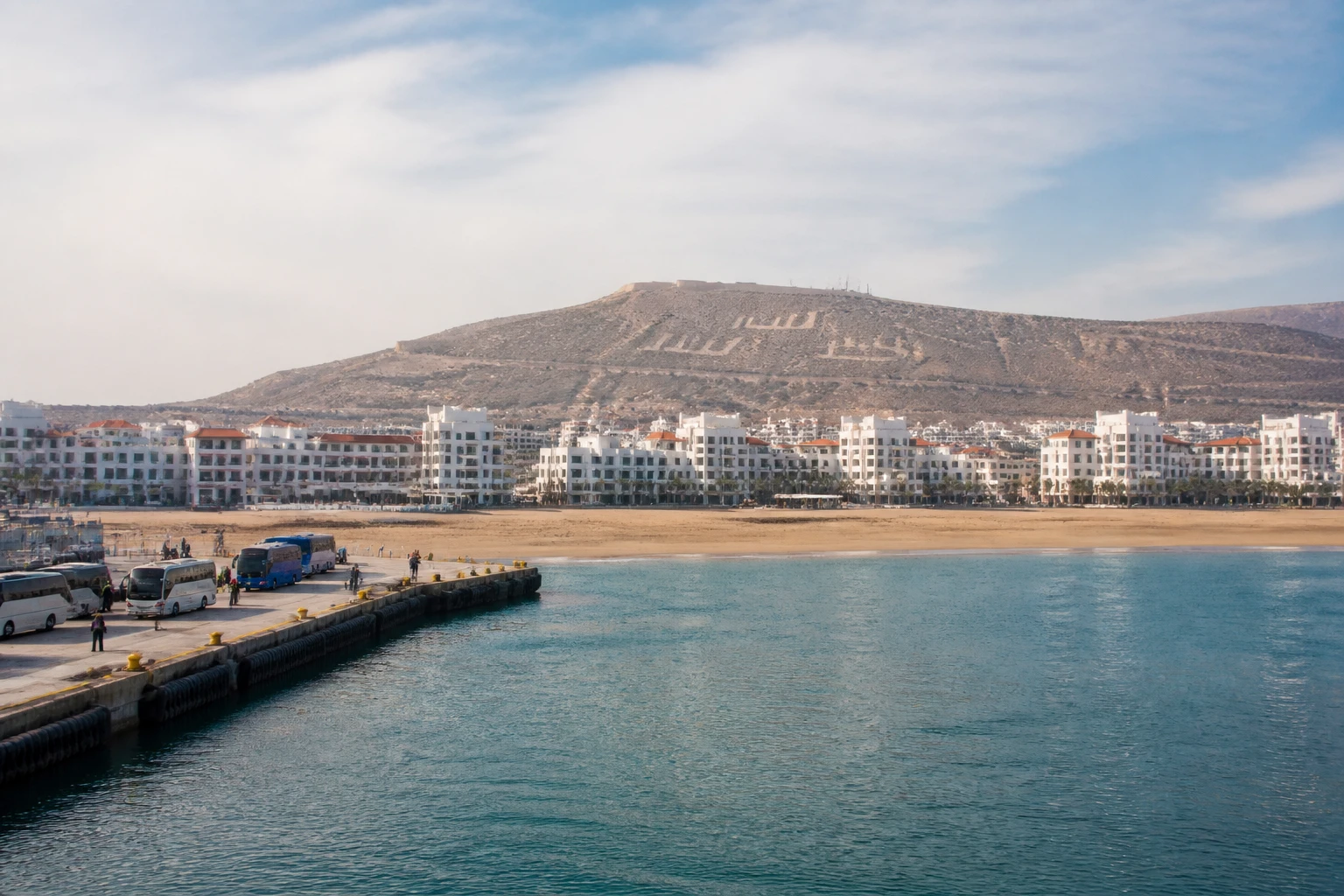 Representative cruise port destination view: Agadir, Morocco; passenger waterfront and harbor water, not an exact landmark photograph.