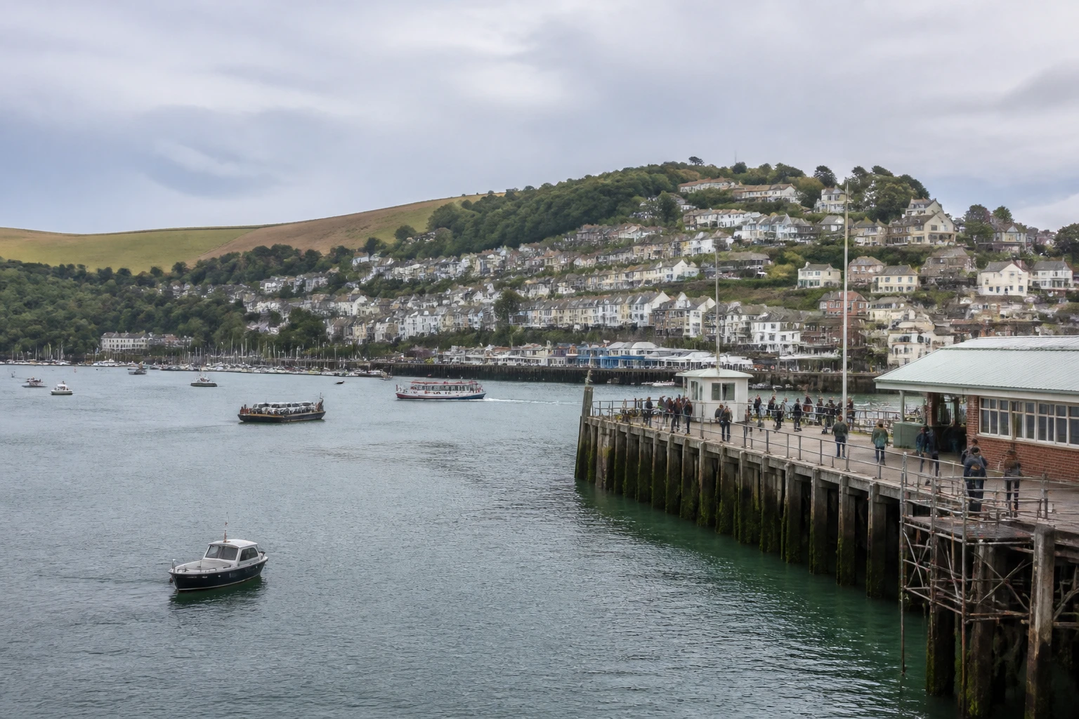 Representative cruise port destination view: Dartmouth, United Kingdom; passenger waterfront and harbor water, not an exact landmark photograph.