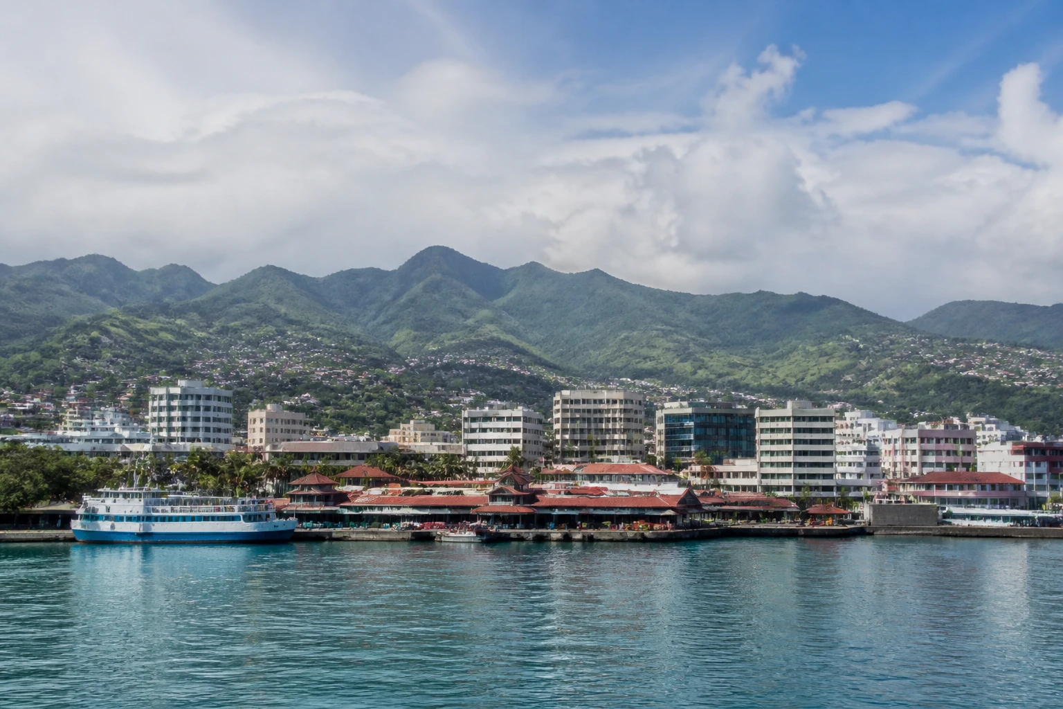 Representative cruise port destination view: Papeete, French Polynesia; passenger waterfront and harbor water, not an exact landmark photograph.