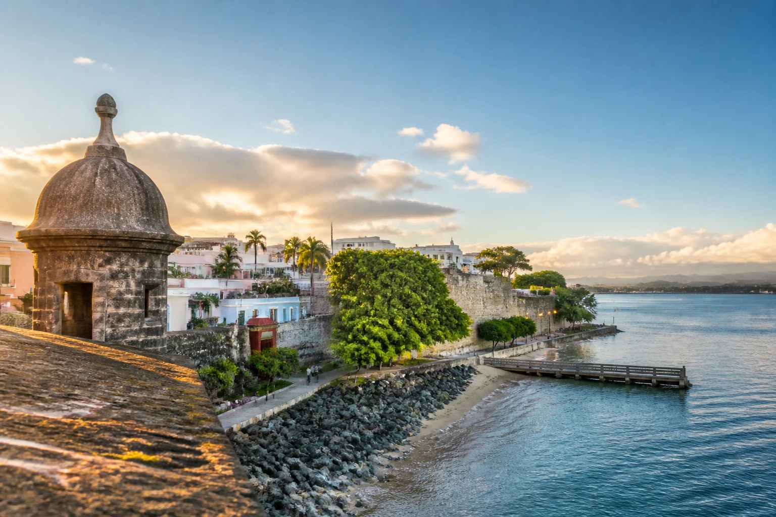 Representative city destination view: San Juan, Puerto Rico; passenger waterfront and harbor water, not an exact landmark photograph.