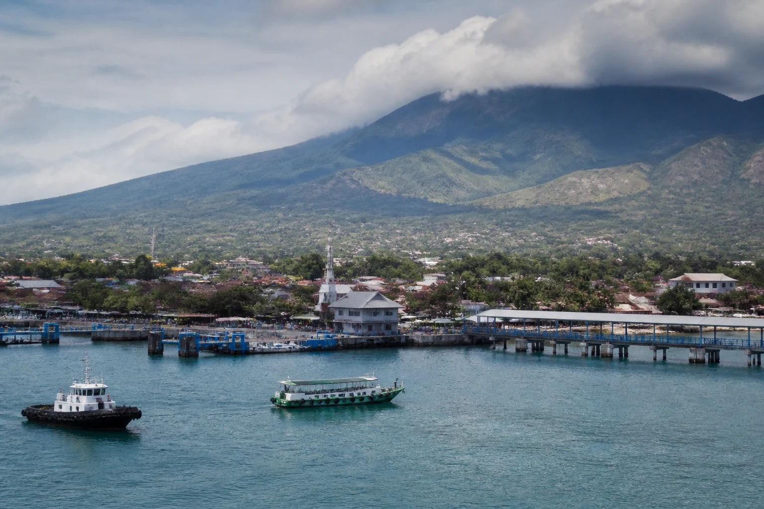 Representative cruise port destination view: Probolinggo, Indonesia; passenger waterfront and harbor water, not an exact landmark photograph.