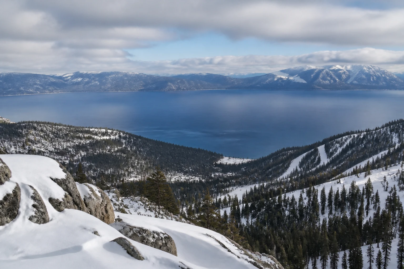 Representative lake destination view: Lake Tahoe, United States; mountain or canyon terrain and regional vegetation, not an exact landmark photograph.