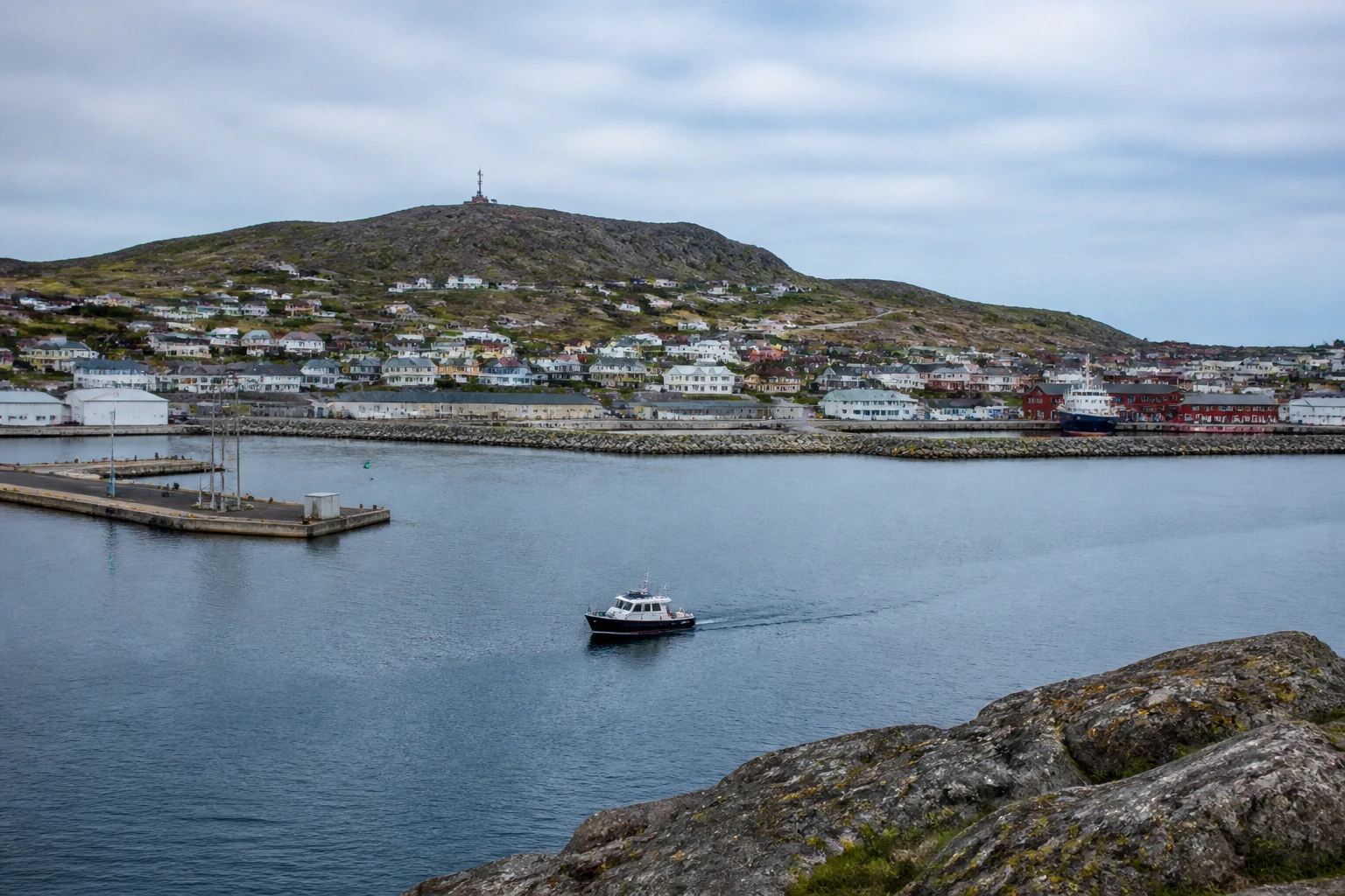 Representative cruise port destination view: St. Pierre And Miquelon, France; passenger waterfront and harbor water, not an exact landmark photograph.