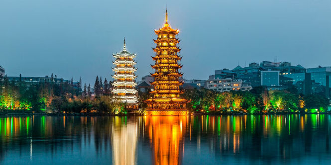 Ancient stone columns, carvings and temple architecture in Pagodas Reflected Light Lake Guilin.