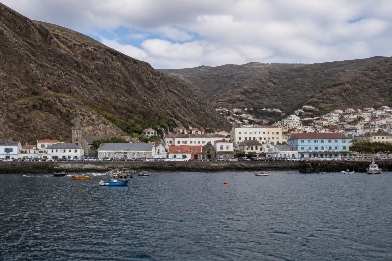 Representative cruise port destination view: Jamestown, St. Helena; passenger waterfront and harbor water, not an exact landmark photograph.