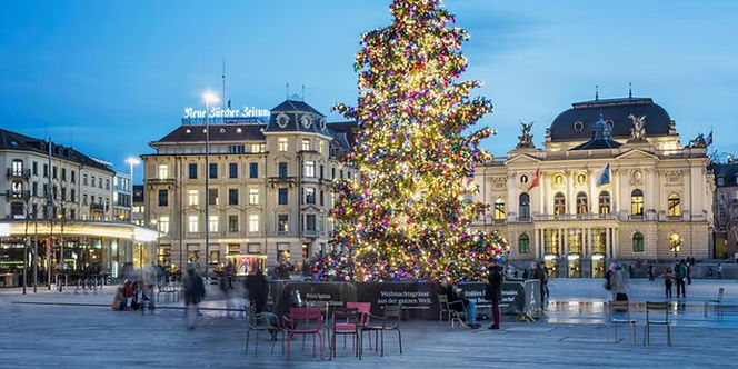 Market stalls, festive lights and local architecture in Zürich, Switzerland.