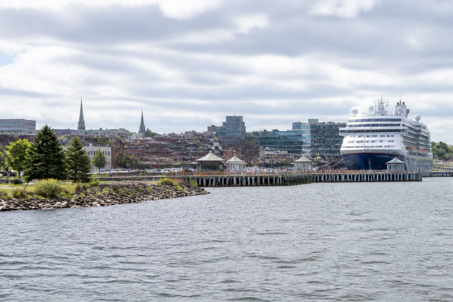 Representative cruise port destination view: Charlottetown, Canada; passenger waterfront and harbor water, not an exact landmark photograph.