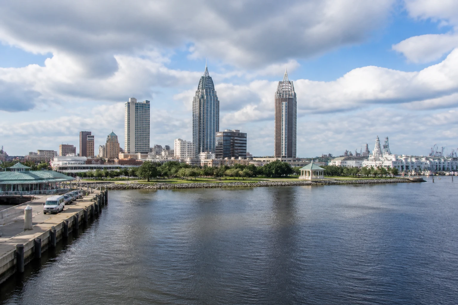 Representative cruise port destination view: Mobile, United States; passenger waterfront and harbor water, not an exact landmark photograph.