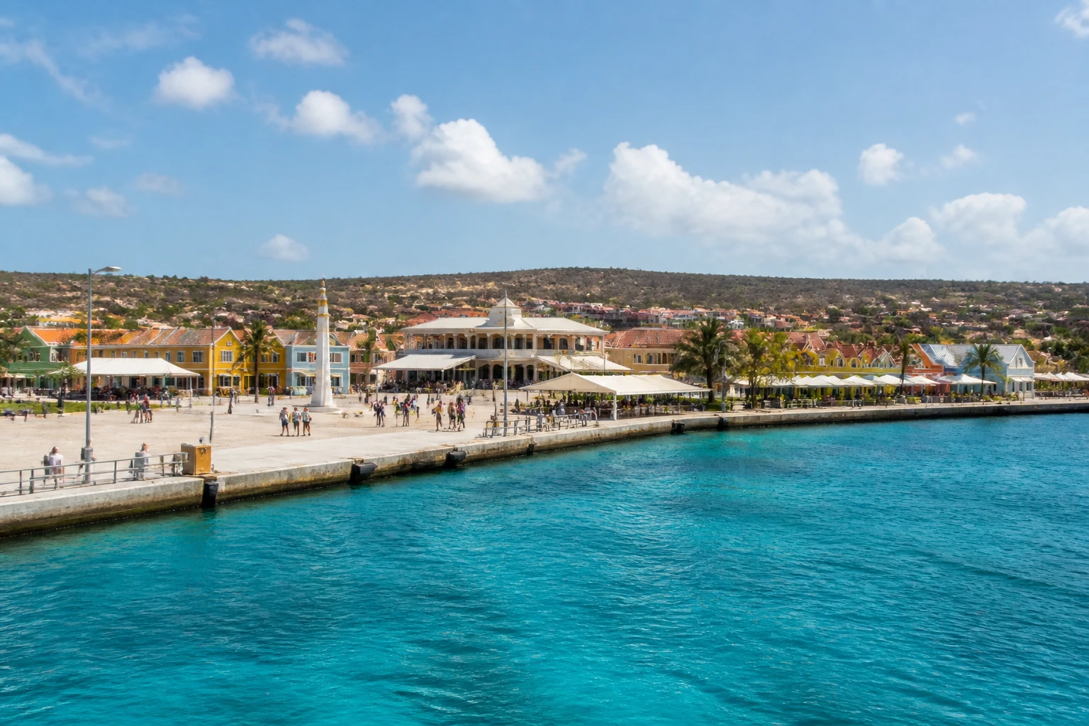 Representative cruise port destination view: Kralendijk, Bonaire; passenger waterfront and harbor water, not an exact landmark photograph.