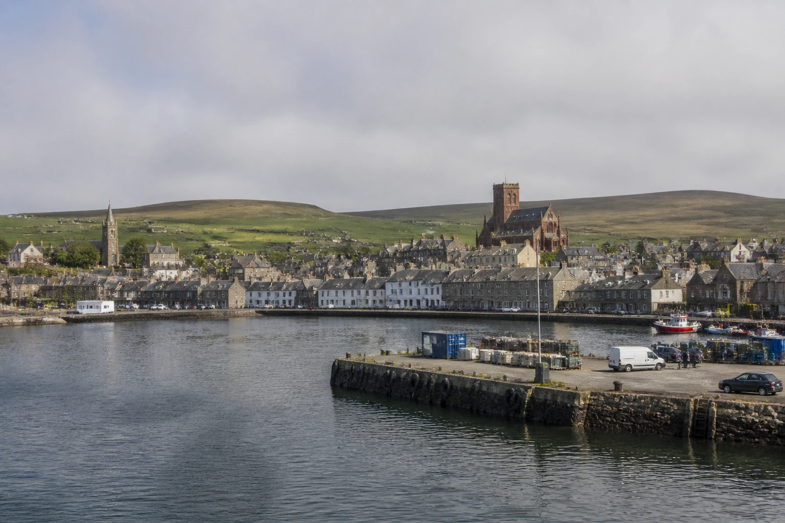 Representative cruise port destination view: Kirkwall, United Kingdom; passenger waterfront and harbor water, not an exact landmark photograph.