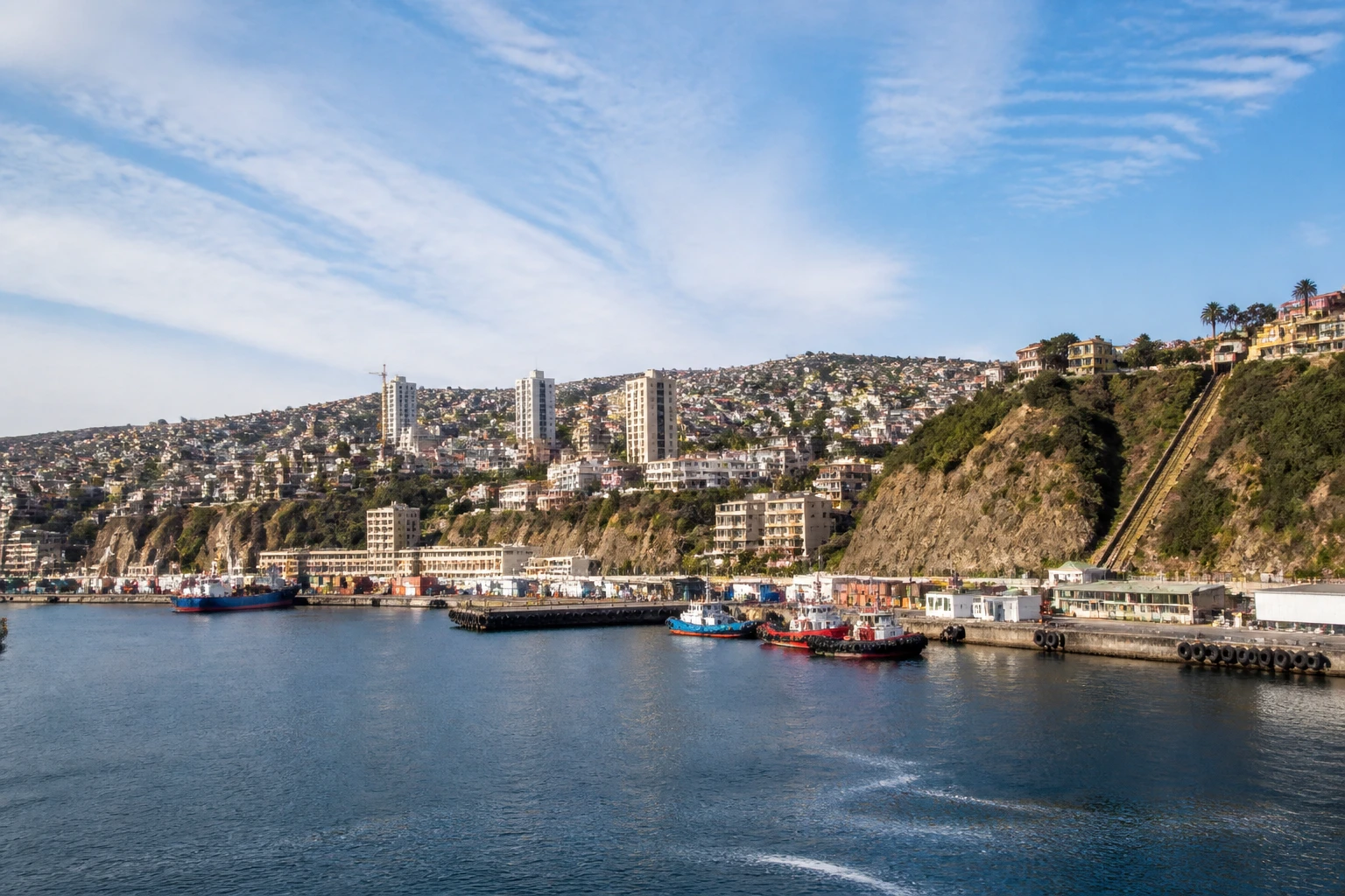 Representative cruise port destination view: Valparaiso, Chile; passenger waterfront and harbor water, not an exact landmark photograph.
