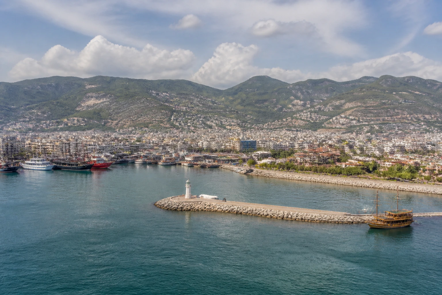 Representative cruise port destination view: Alanya, Turkiye; passenger waterfront and harbor water, not an exact landmark photograph.