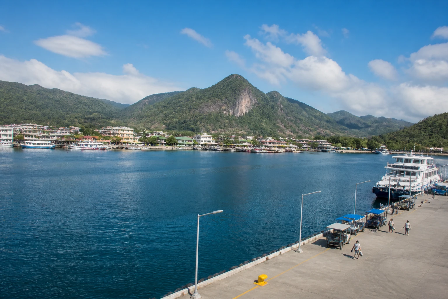 Representative cruise port destination view: Coron, Philippines; passenger waterfront and harbor water, not an exact landmark photograph.