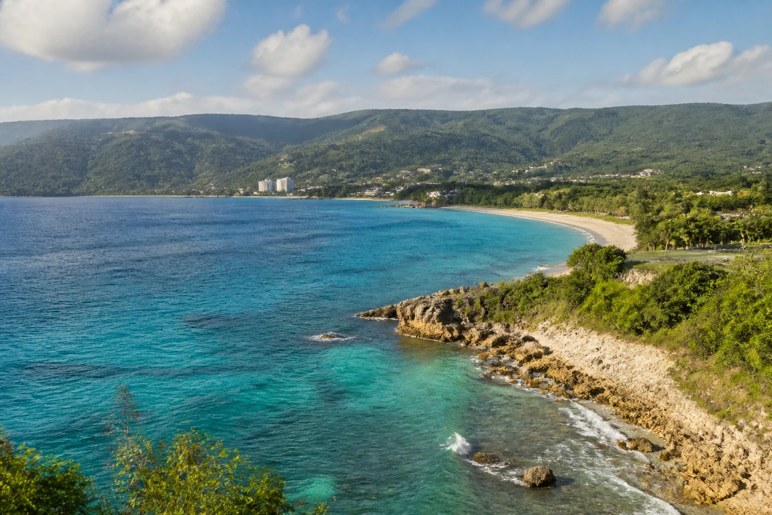 Representative coastal destination view: Montego Bay, Jamaica; coastline and regional vegetation, not an exact landmark photograph.