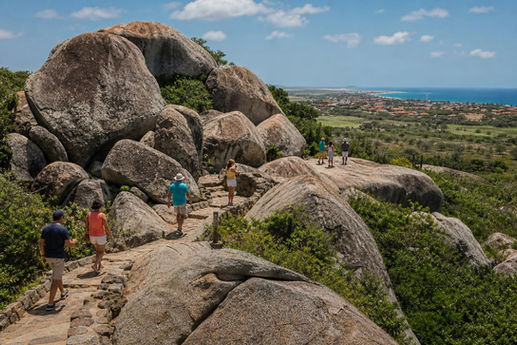 Visitors exploring the Casibari Rock Formations during an Aruba island tour