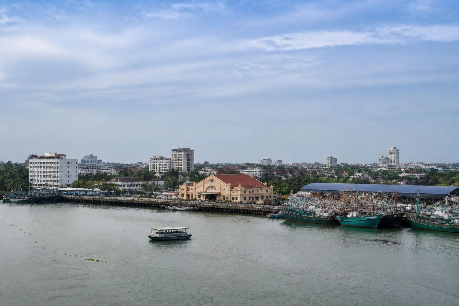 Representative cruise port destination view: Cochin, India; passenger waterfront and harbor water, not an exact landmark photograph.
