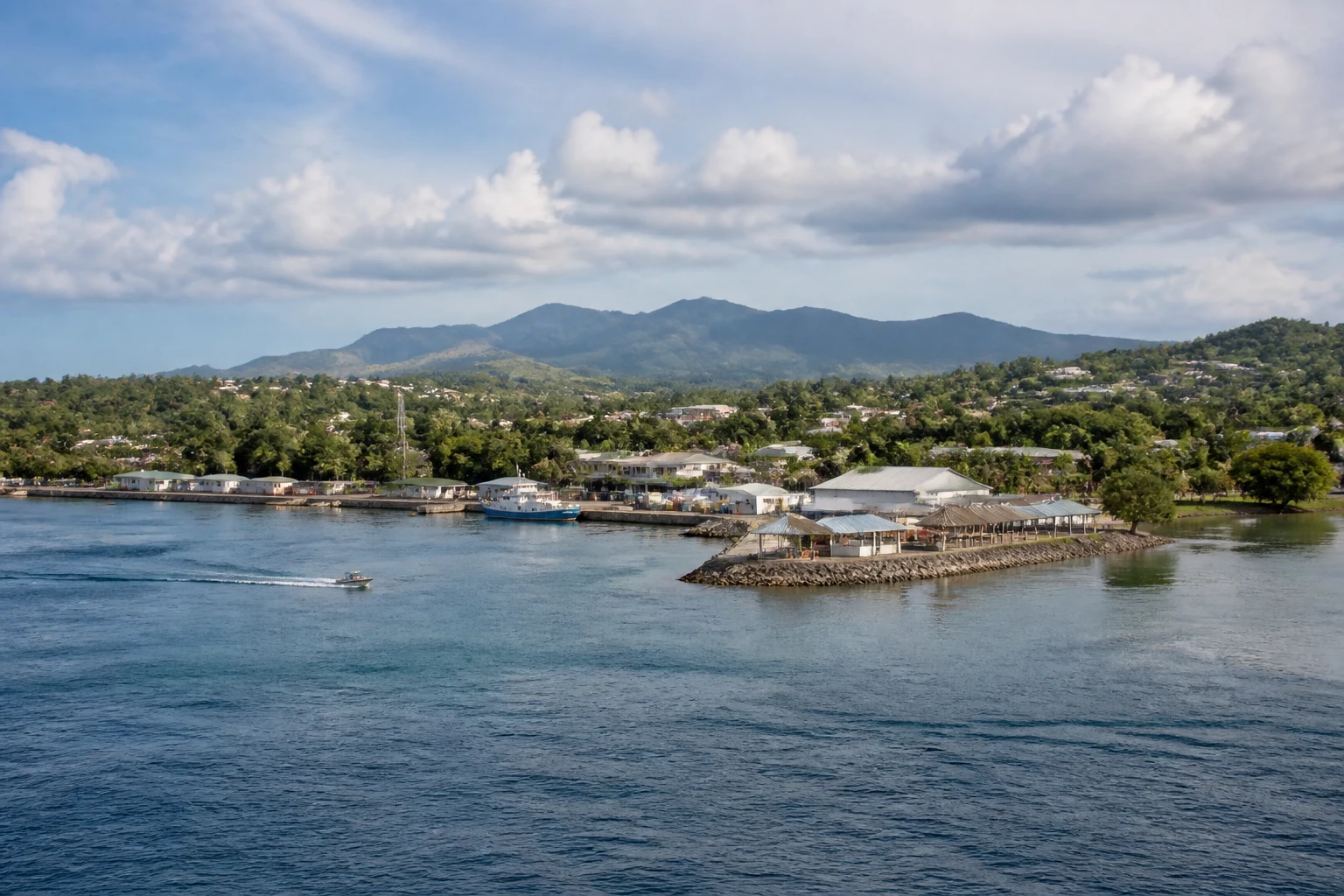 Representative cruise port destination view: Guadalcanal, Solomon Islands; passenger waterfront and harbor water, not an exact landmark photograph.