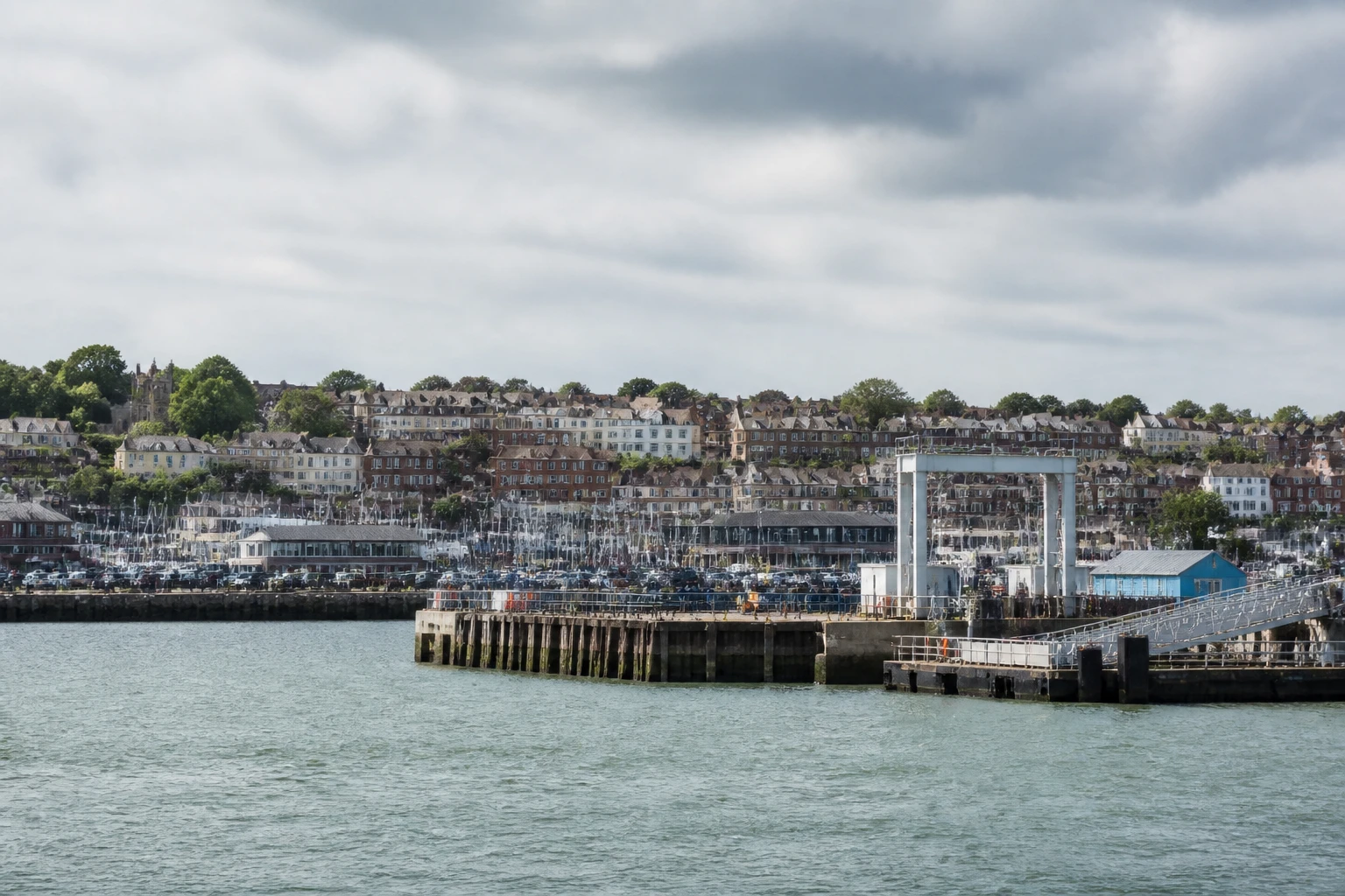 Representative cruise port destination view: Cowes, United Kingdom; passenger waterfront and harbor water, not an exact landmark photograph.
