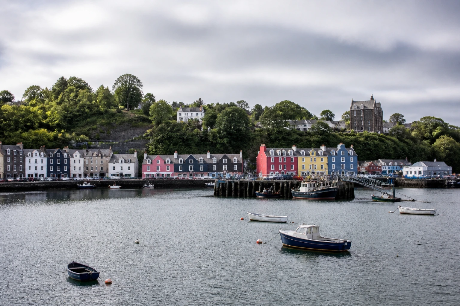 Representative cruise port destination view: Tobermory, United Kingdom; passenger waterfront and harbor water, not an exact landmark photograph.