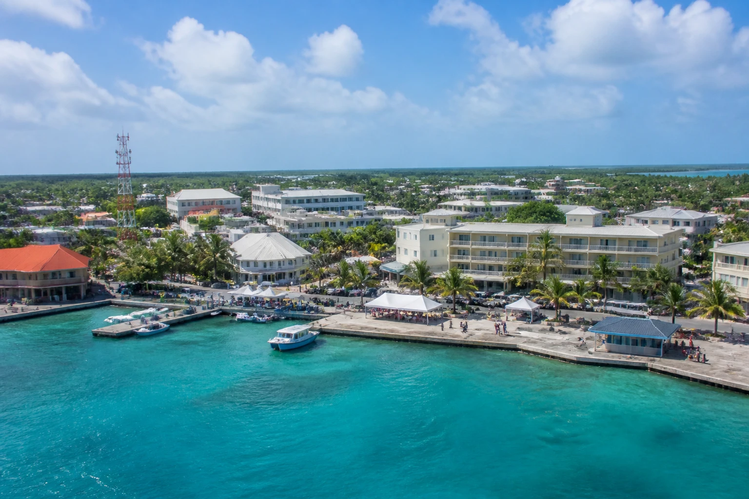 Representative cruise port destination view: Georgetown, Cayman Islands; passenger waterfront and harbor water, not an exact landmark photograph.