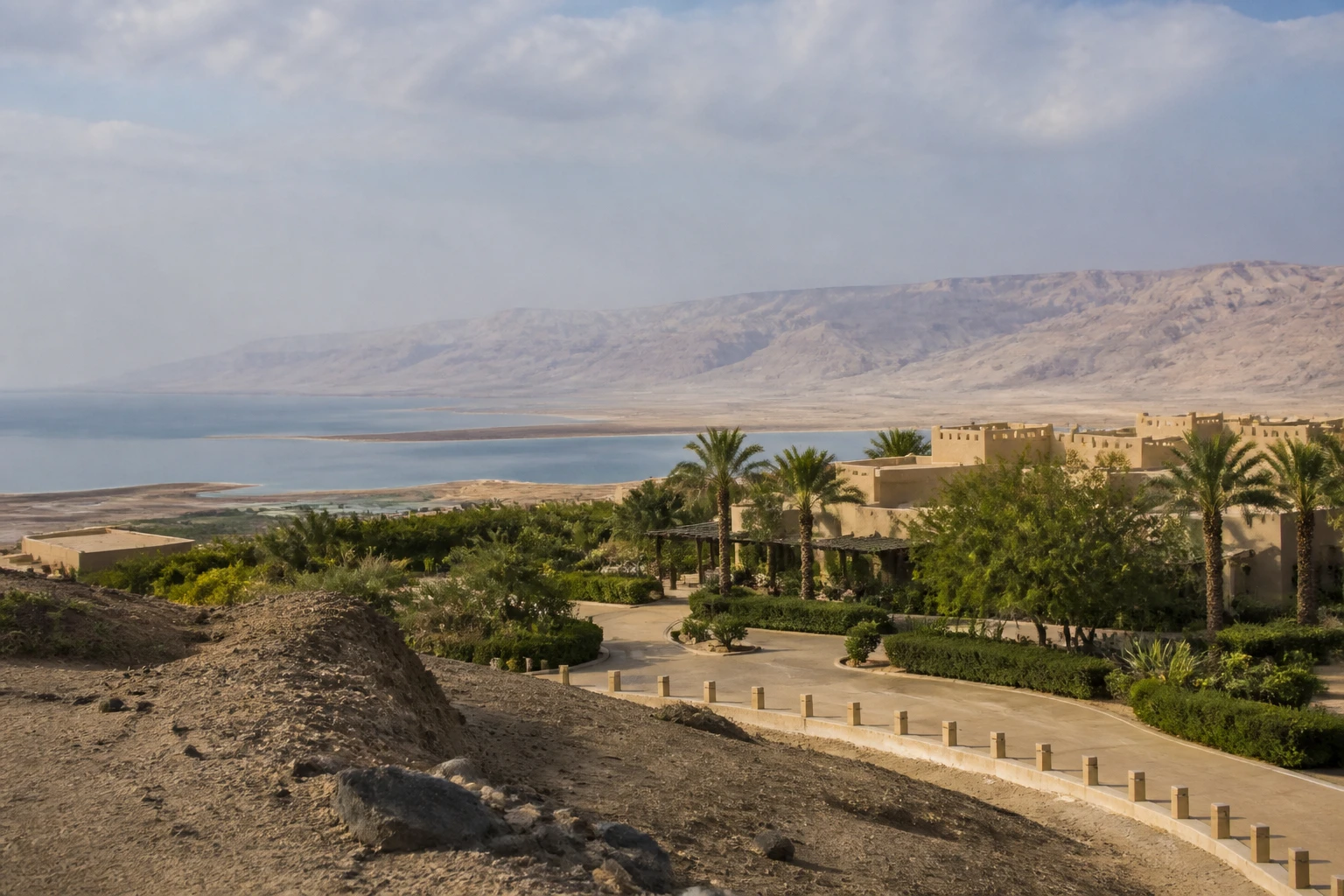 Representative resort destination view: Dead Sea, Jordan; regional setting and resort-area public space, not an exact landmark photograph.