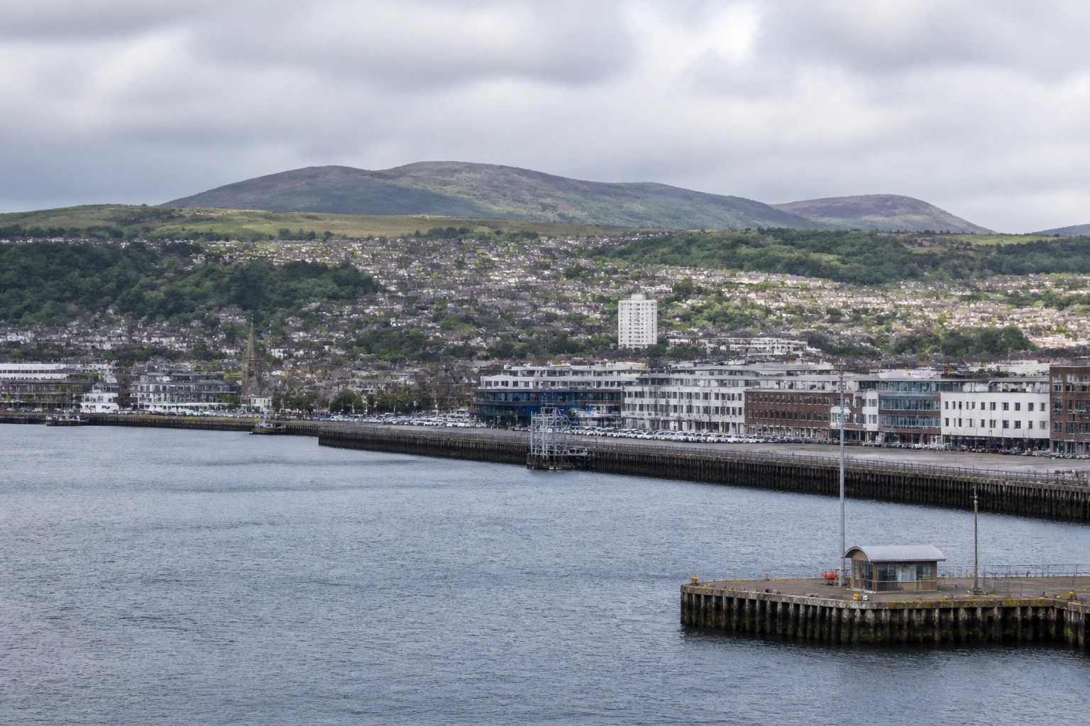 Representative cruise port destination view: Greenock, United Kingdom; passenger waterfront and harbor water, not an exact landmark photograph.
