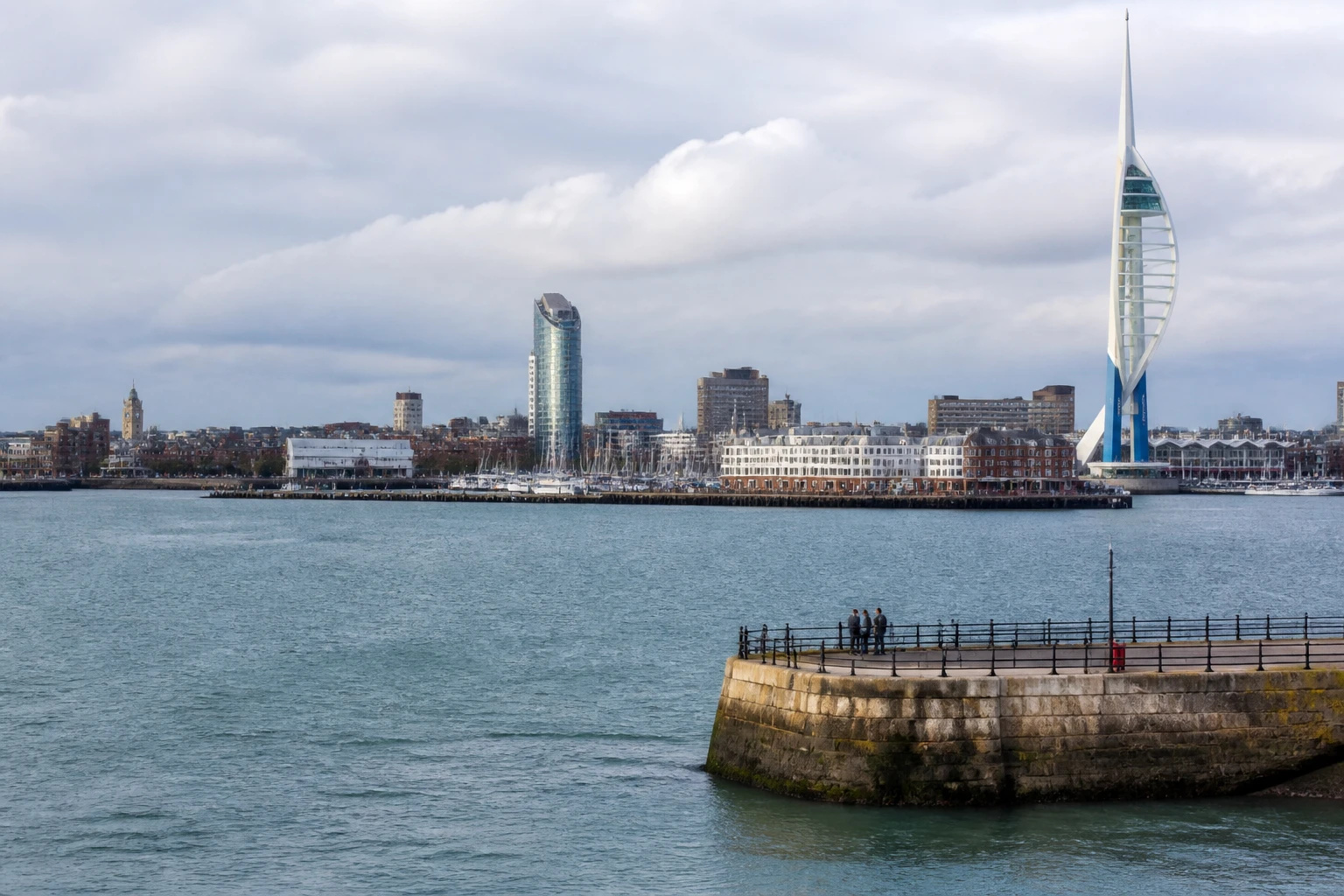 Representative cruise port destination view: Portsmouth, United Kingdom; passenger waterfront and harbor water, not an exact landmark photograph.