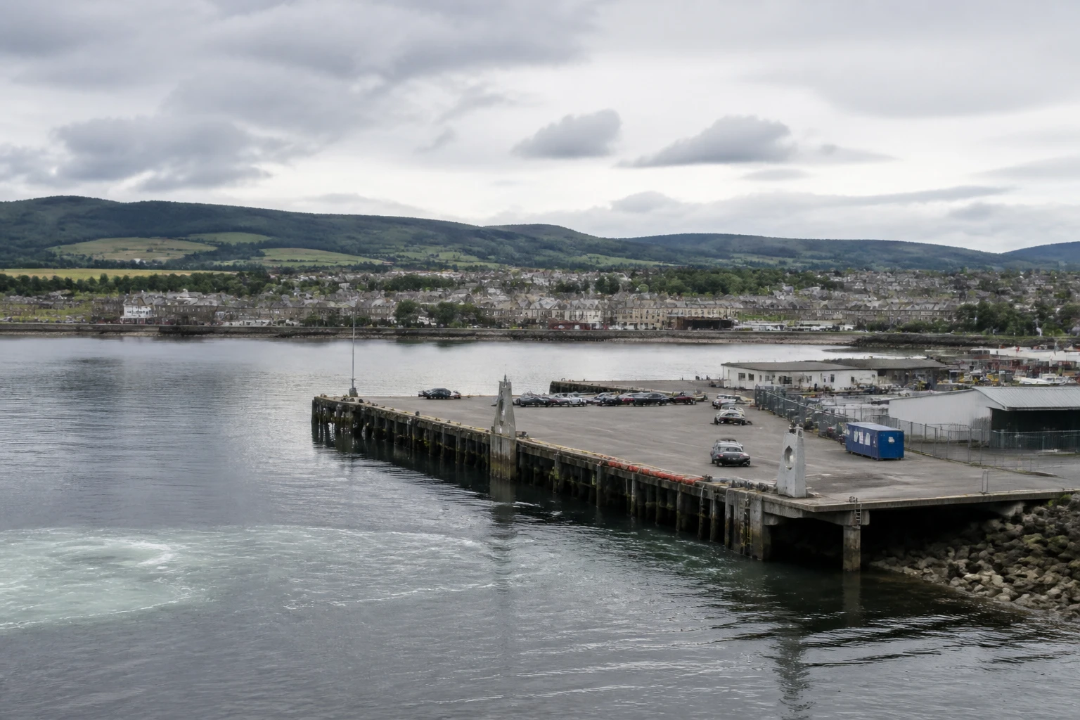 Representative cruise port destination view: Invergordon, United Kingdom; passenger waterfront and harbor water, not an exact landmark photograph.