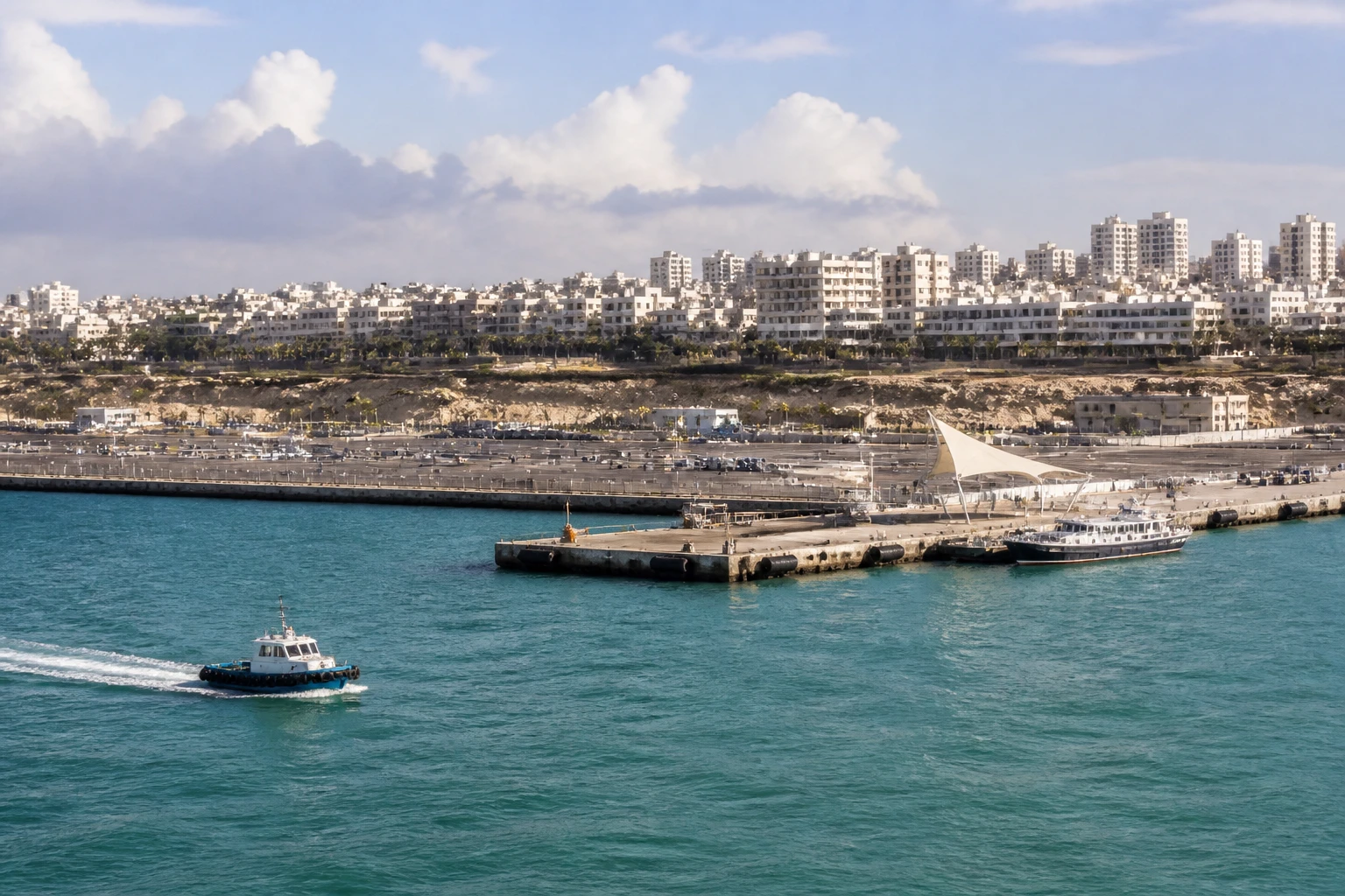 Representative cruise port destination view: Ashdod, Israel; passenger waterfront and harbor water, not an exact landmark photograph.