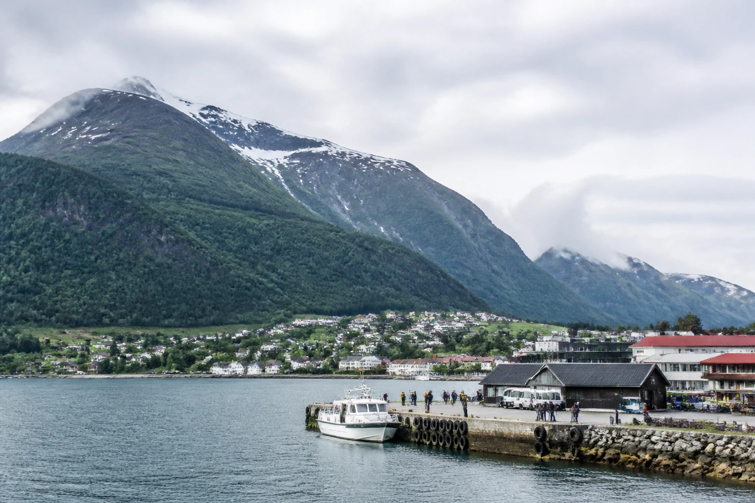 Representative cruise port destination view: Rosendal, Norway; passenger waterfront and harbor water, not an exact landmark photograph.