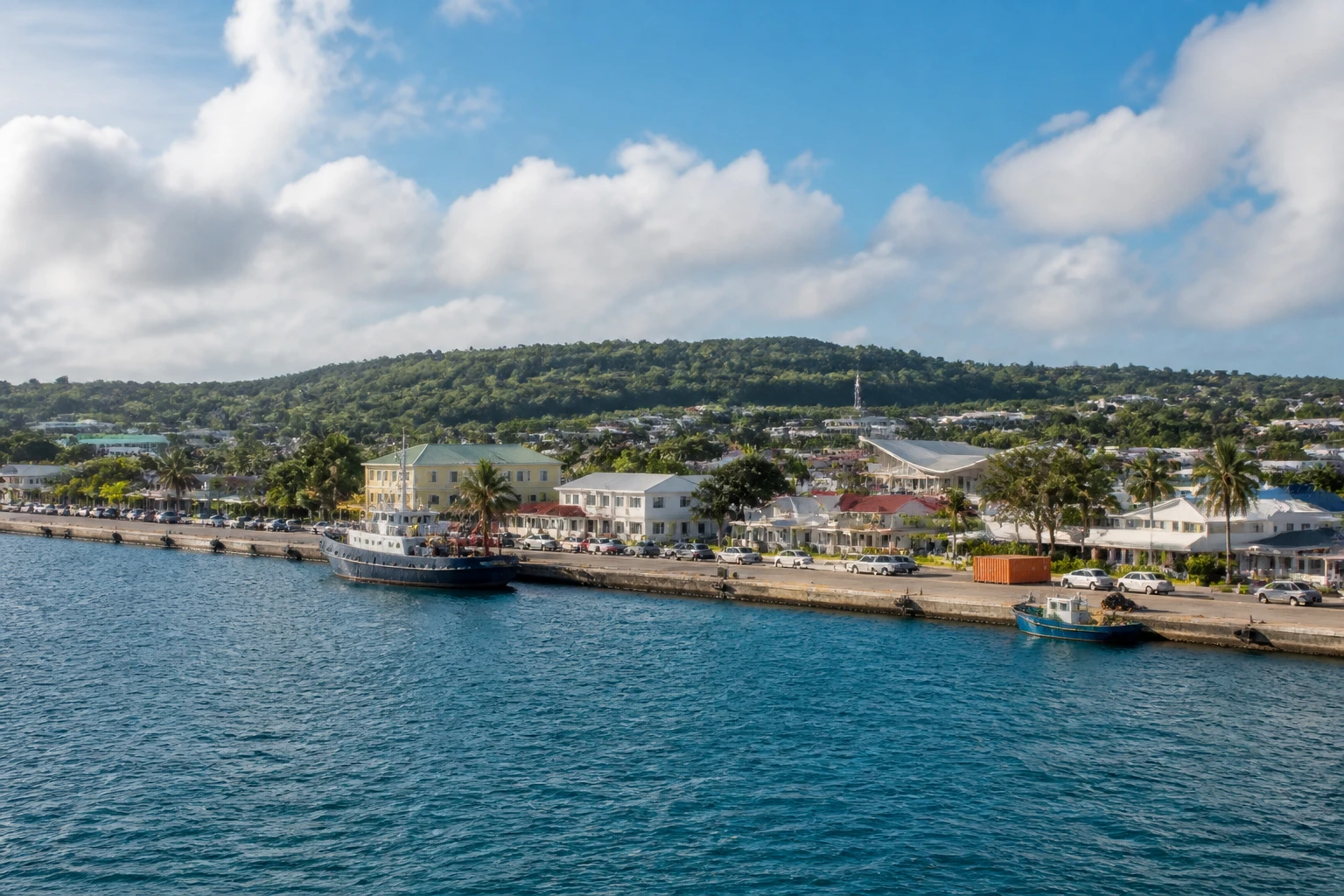 Representative cruise port destination view: Nuku'alofa, Tonga; passenger waterfront and harbor water, not an exact landmark photograph.