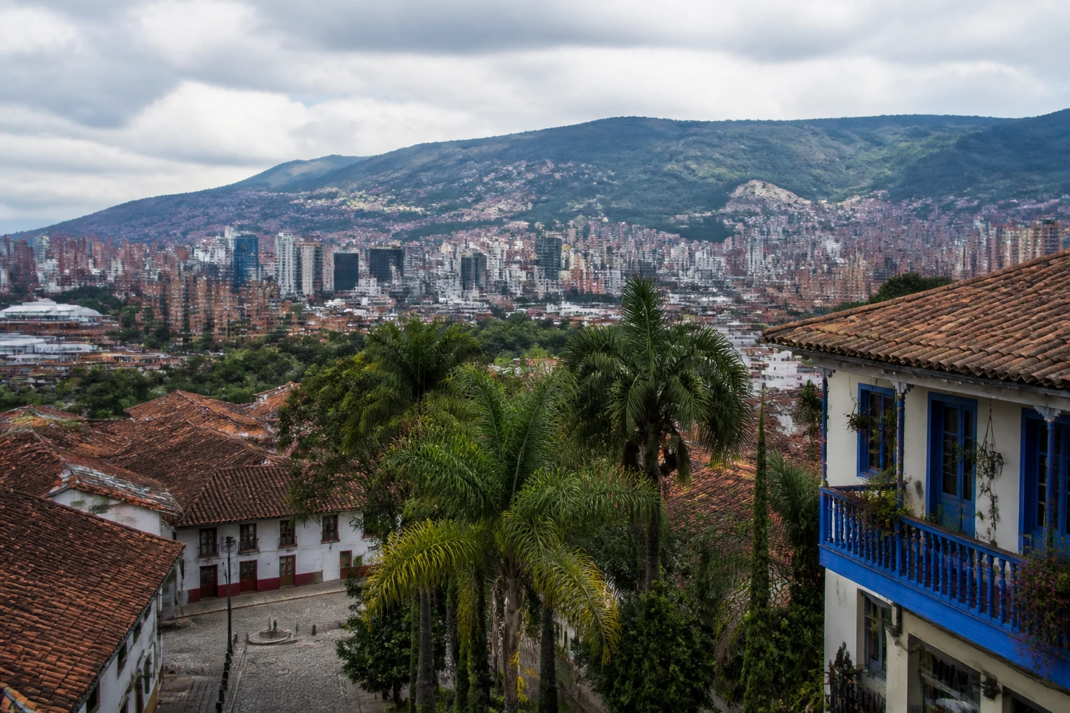 Representative city destination view: Medellin, Colombia; local streetscape and regional architecture, not an exact landmark photograph.