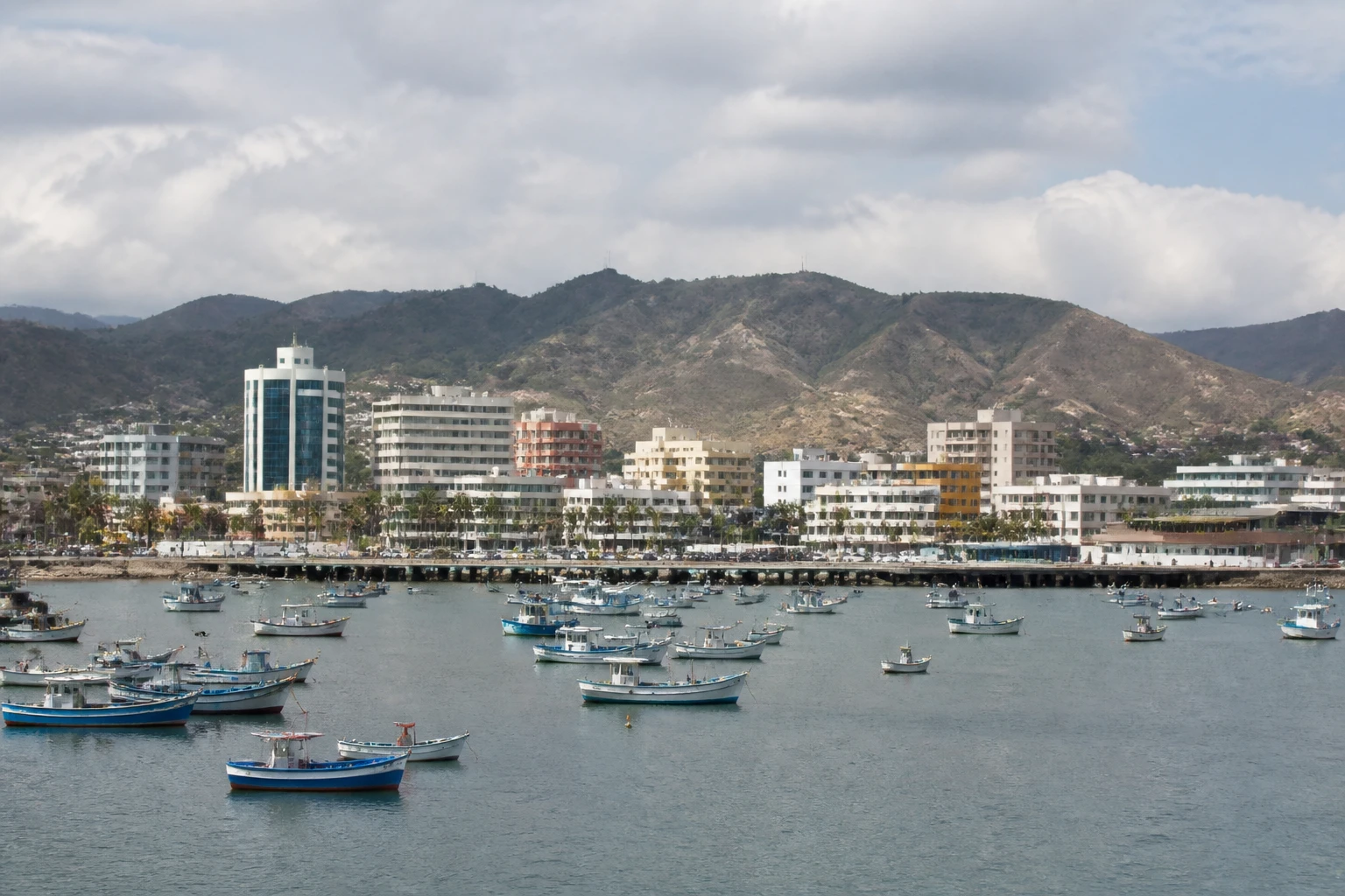 Representative cruise port destination view: Manta, Ecuador; passenger waterfront and harbor water, not an exact landmark photograph.