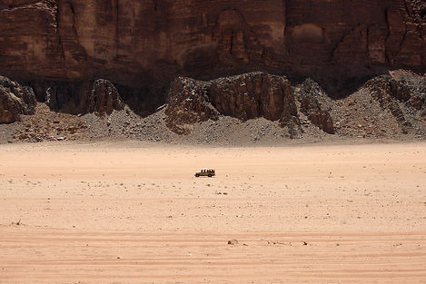 the sandstone mountains and desert of Wadi Rum, Jordan, a destination or experience featured on the Jordan Escape and Iconic Arabia 7-Night Cruise tour