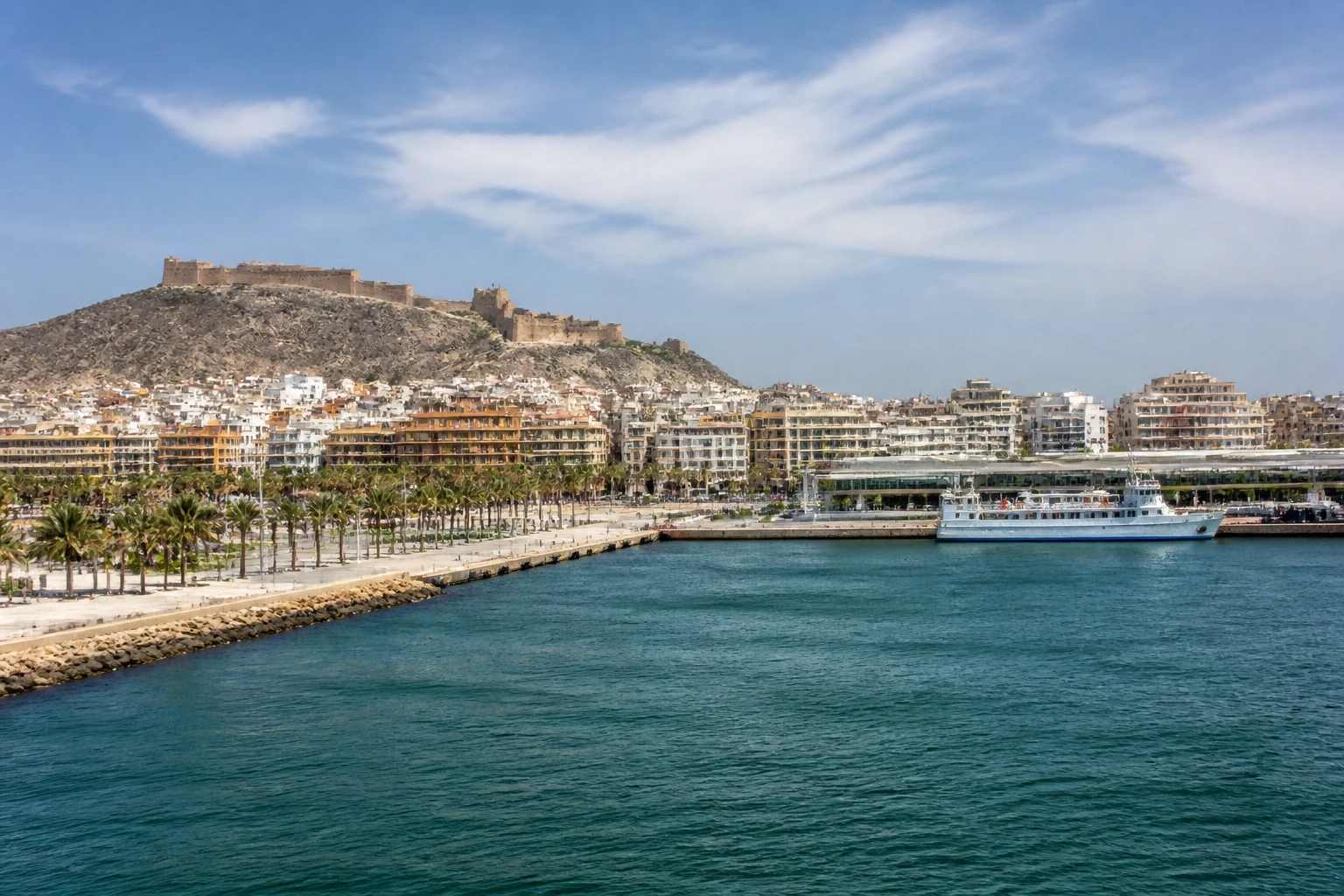 Representative cruise port destination view: Almeria, Spain; passenger waterfront and harbor water, not an exact landmark photograph.