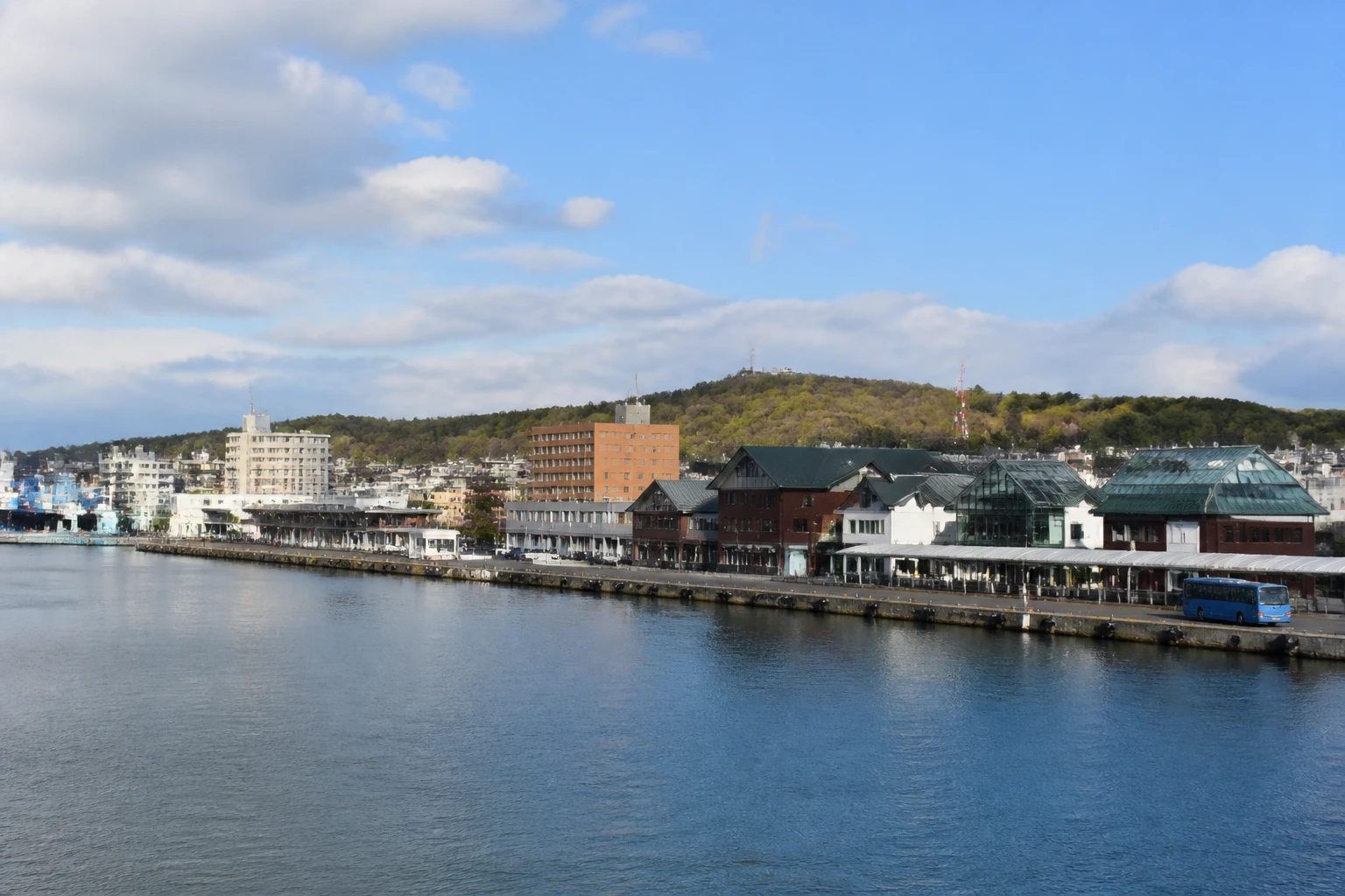 Representative cruise port destination view: Kushiro, Japan; passenger waterfront and harbor water, not an exact landmark photograph.