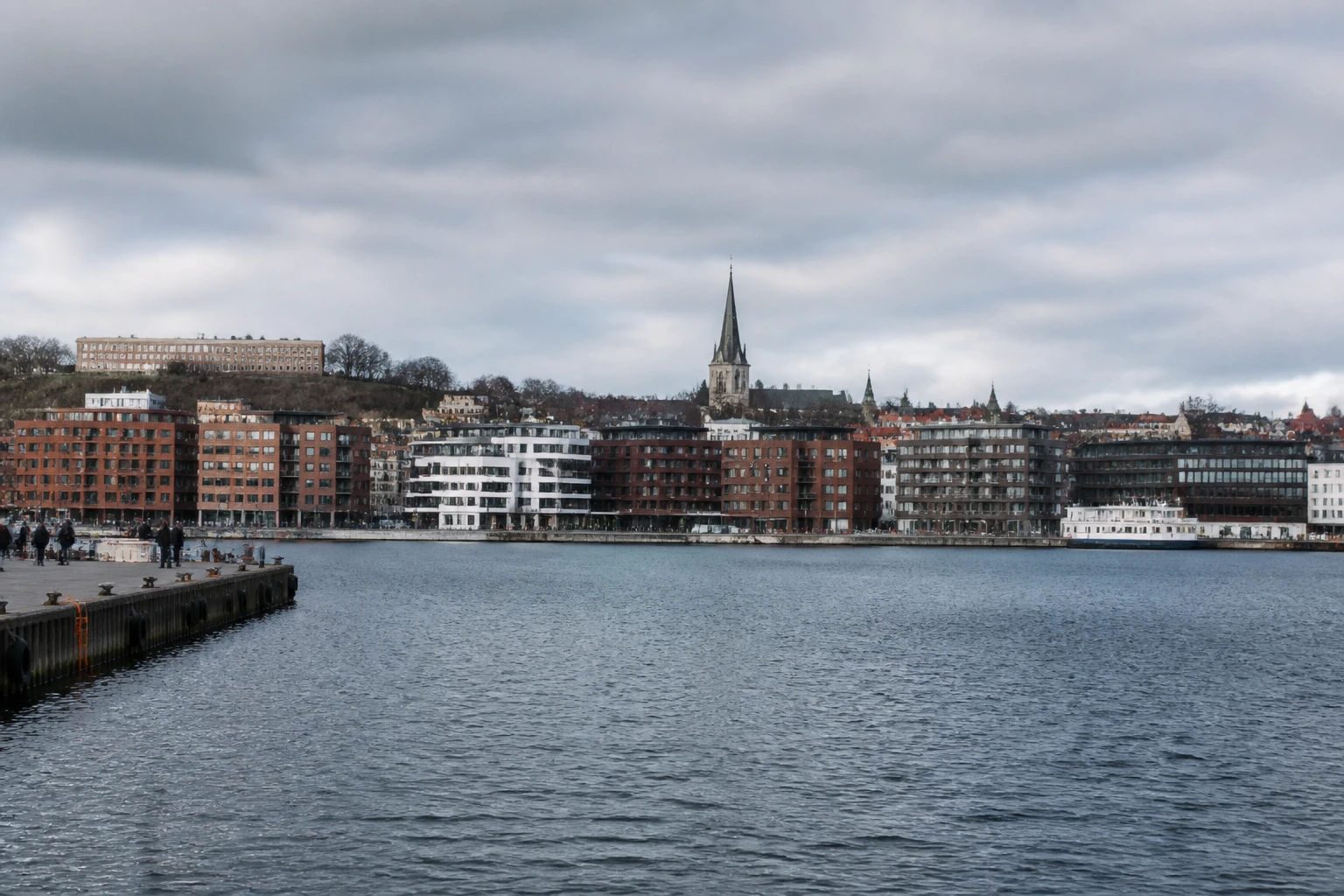 Representative cruise port destination view: Aalborg, Denmark; passenger waterfront and harbor water, not an exact landmark photograph.