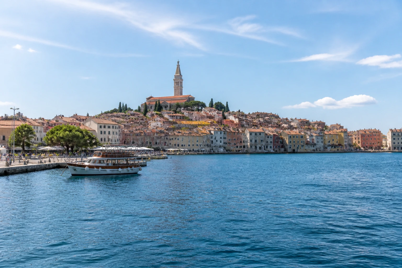 Representative cruise port destination view: Rovinj, Croatia; passenger waterfront and harbor water, not an exact landmark photograph.