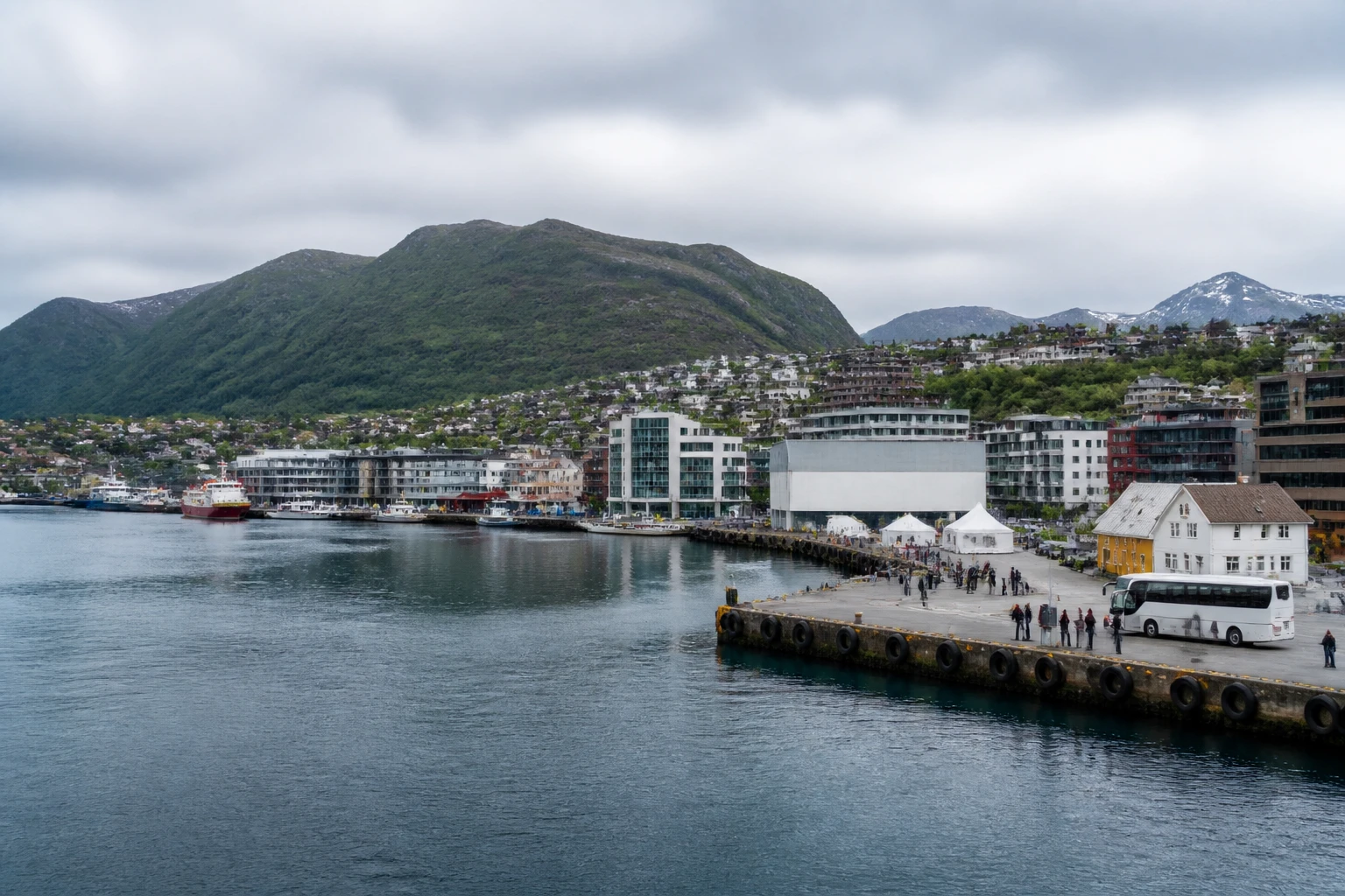 Representative cruise port destination view: Harstad, Norway; passenger waterfront and harbor water, not an exact landmark photograph.