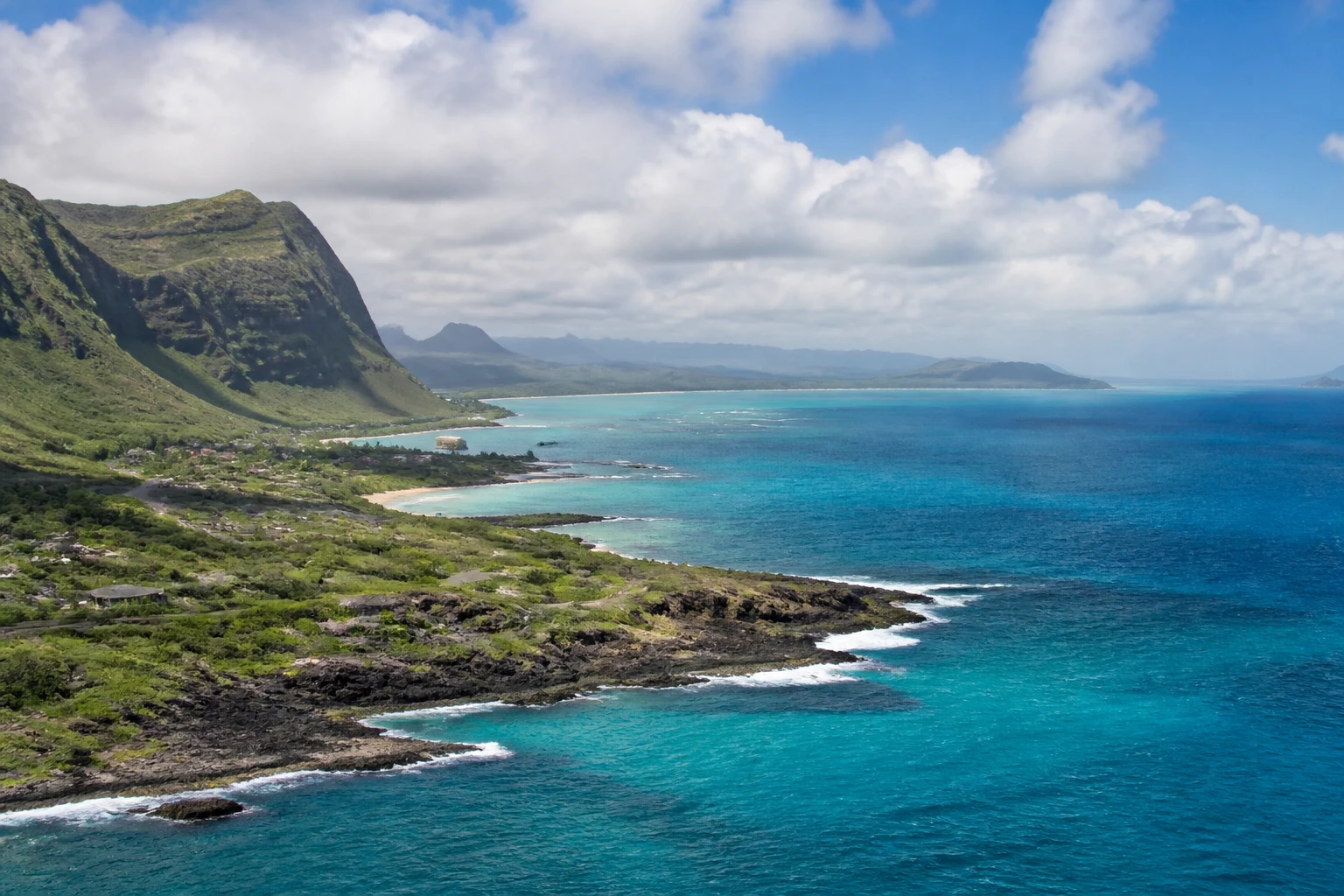 Representative island destination view: Honolulu and Oahu, United States; coastline and regional vegetation, not an exact landmark photograph.
