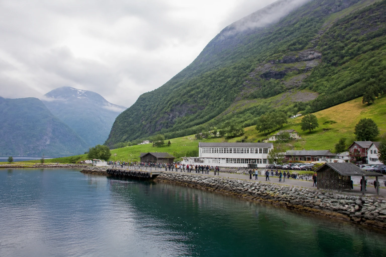 Representative cruise port destination view: Eidsdal, Norway; passenger waterfront and harbor water, not an exact landmark photograph.