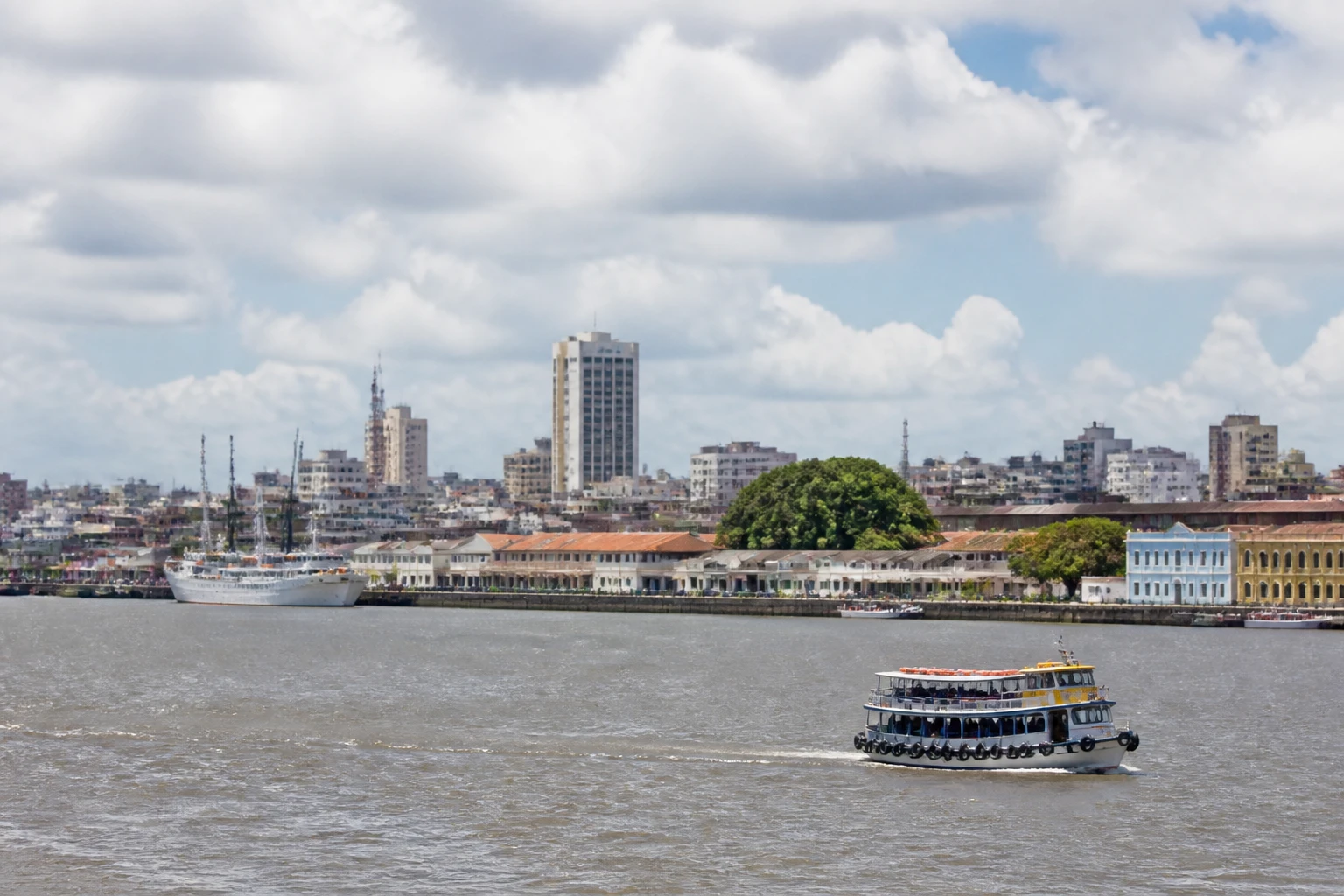 Representative cruise port destination view: Belém, Brazil; passenger waterfront and harbor water, not an exact landmark photograph.