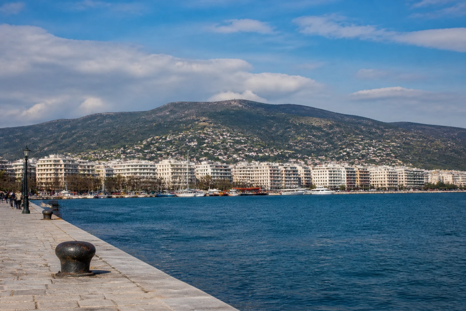 Representative cruise port destination view: Volos, Greece; passenger waterfront and harbor water, not an exact landmark photograph.