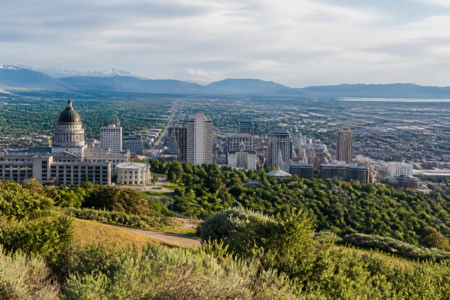 Representative mountain destination view: Salt Lake City, United States; mountain or canyon terrain and regional vegetation, not an exact landmark photograph.