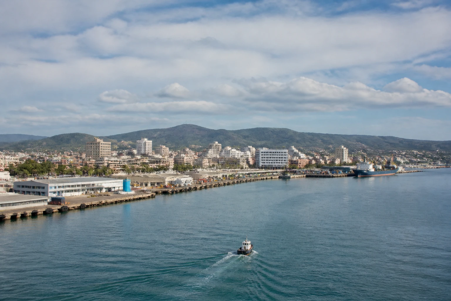 Representative cruise port destination view: Port Elizabeth, South Africa; passenger waterfront and harbor water, not an exact landmark photograph.