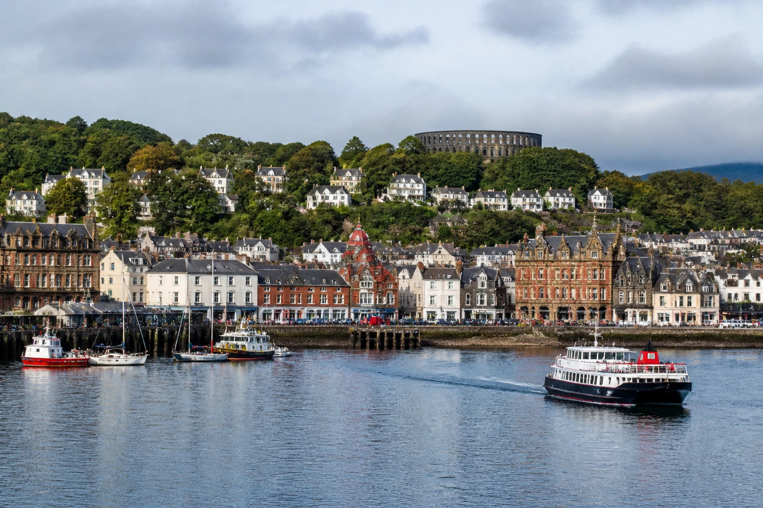 Representative cruise port destination view: Oban, United Kingdom; passenger waterfront and harbor water, not an exact landmark photograph.