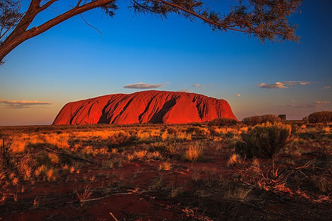 Uluru at Sunset, a destination or experience featured on the Spectacular Australia with the Historic Ghan Train Globus tour